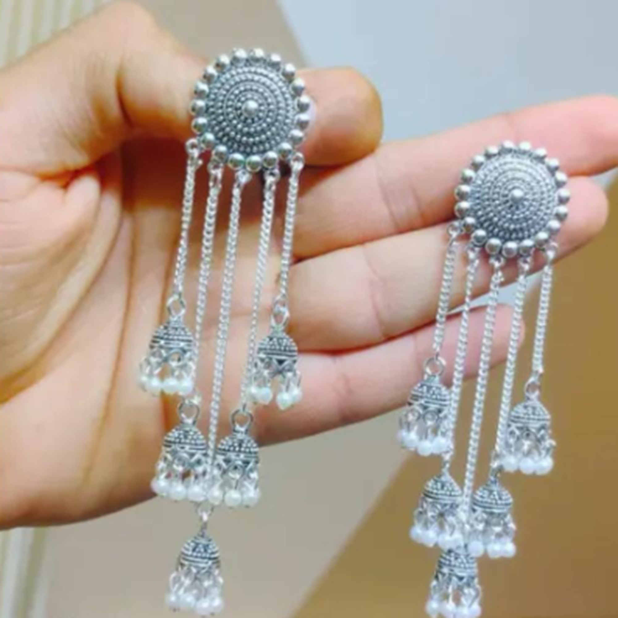 traditional long tassel jhumka earrings gold design
