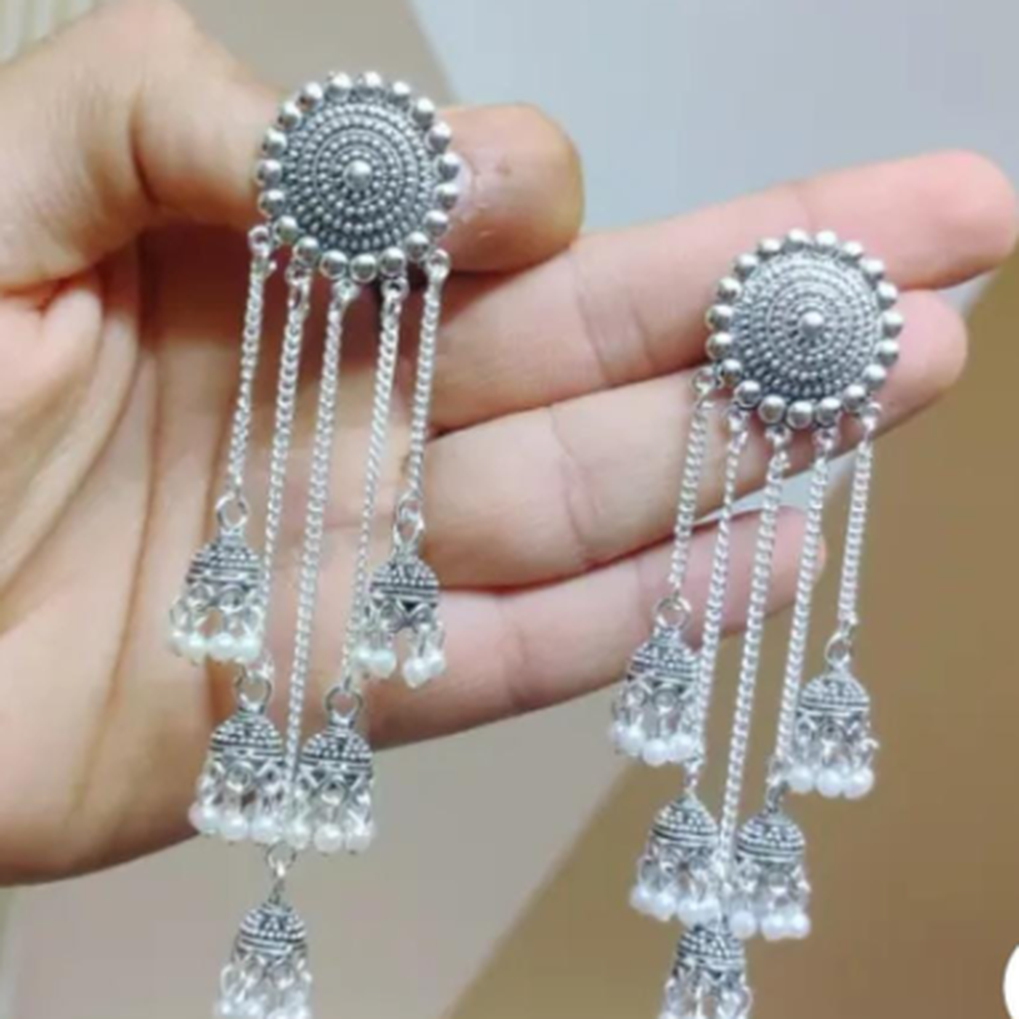 traditional long tassel jhumka earrings gold design